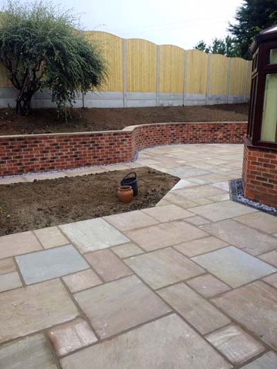 A garden in Pontefract, West Yorkshire, where we erected a fence, built a garden wall and laid some decorative paving.